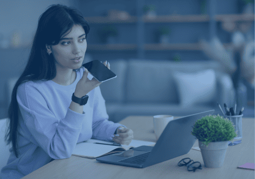 woman talking to her phone on speakerphone